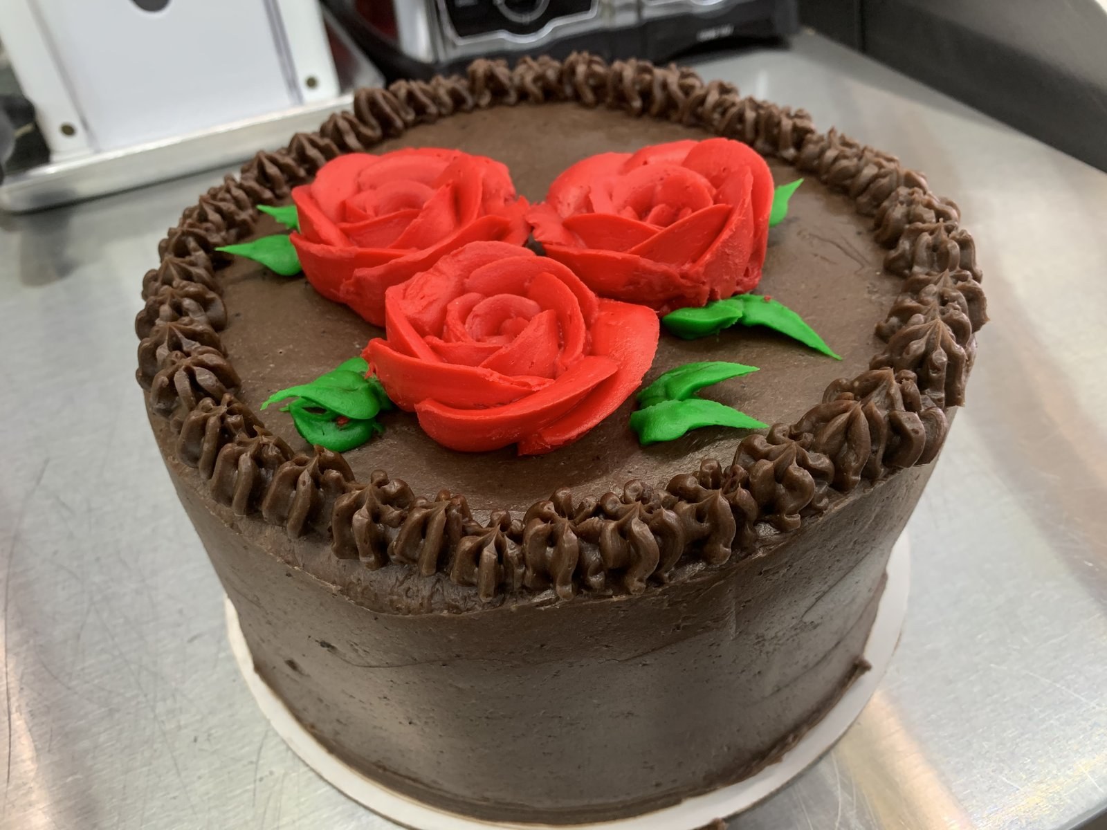 Chocolate cake with red buttercream roses