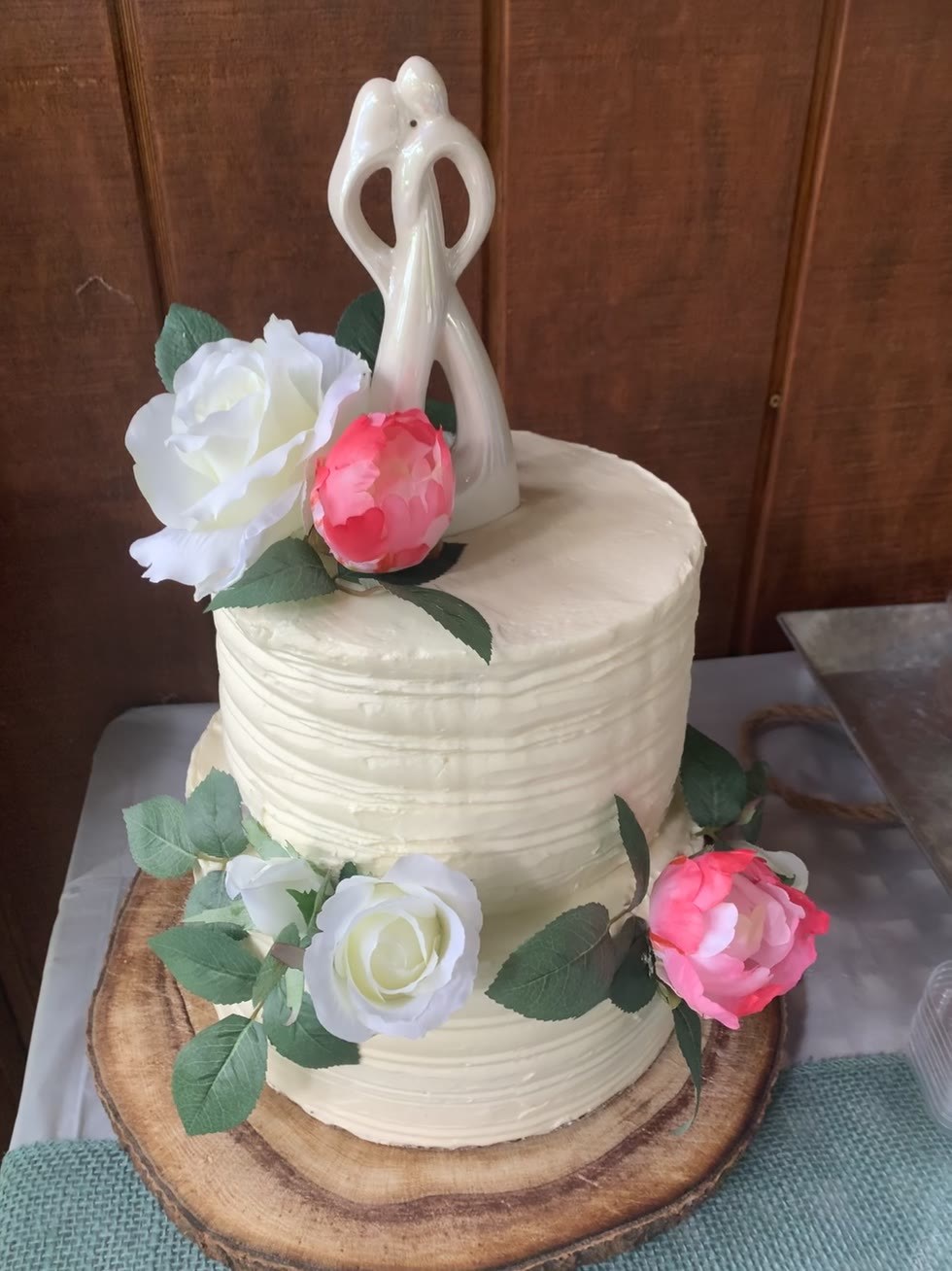 Two-tier wedding cake with fresh roses